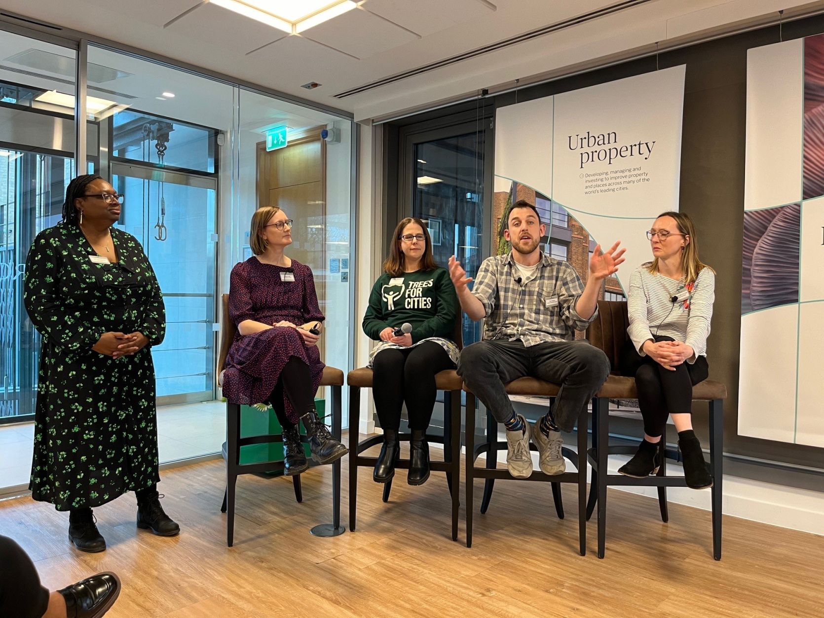 A panel of people sitting in a row at the Grosvenor Greener Futures in Westminster event